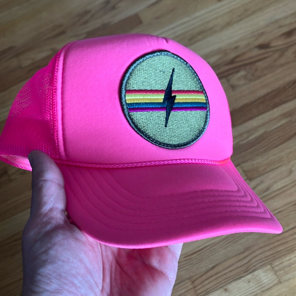 Friday Feelin' electric rainbow trucker hat